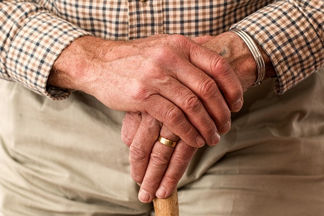 Elderly hands wearing wedding ring